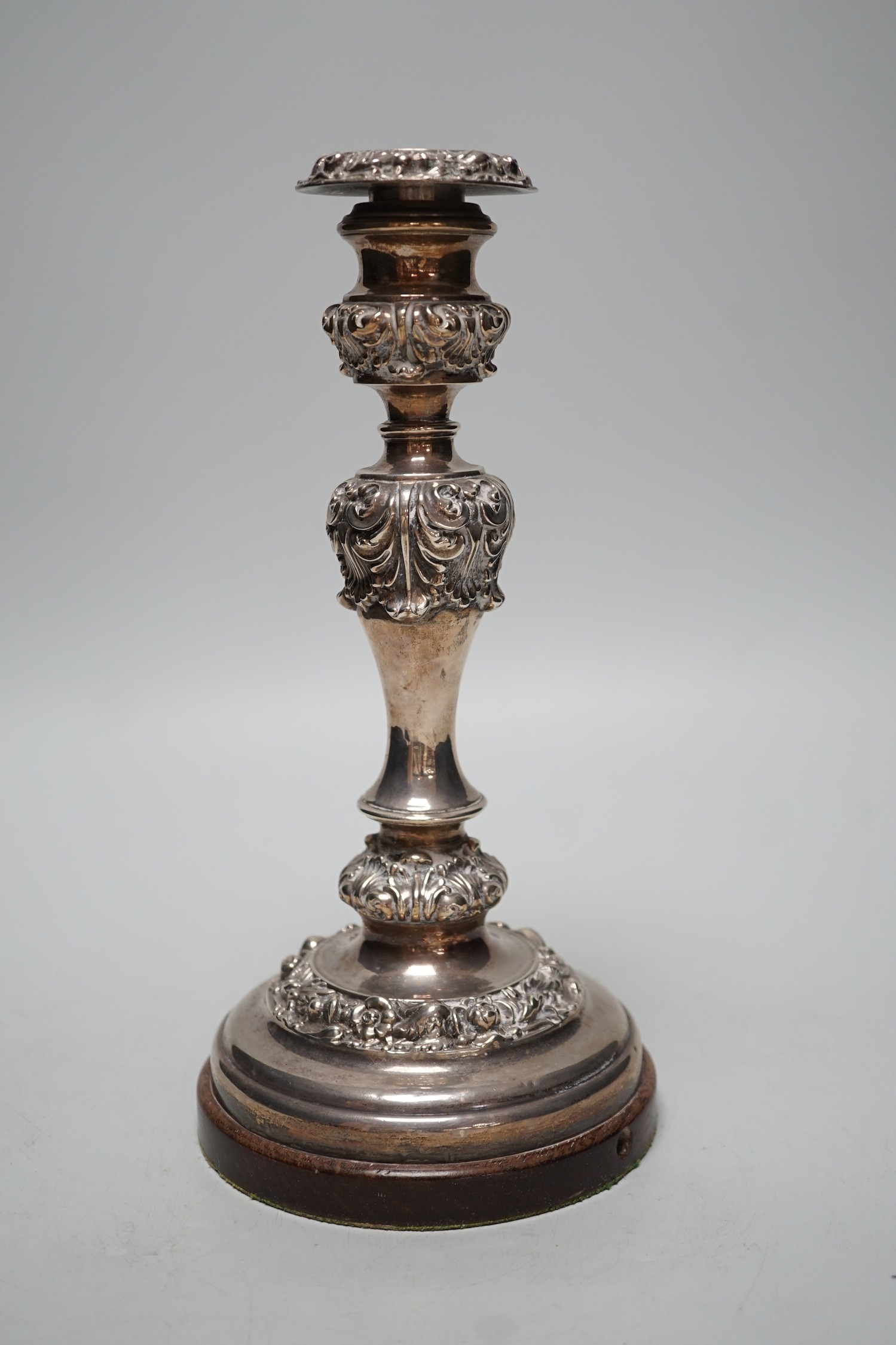 A George IV silver candlestick, Thomas Blagden & Co, Sheffield, 1822, now mounted on a later wooden base, with drill hole for electricity??, overall height 26.9cm.